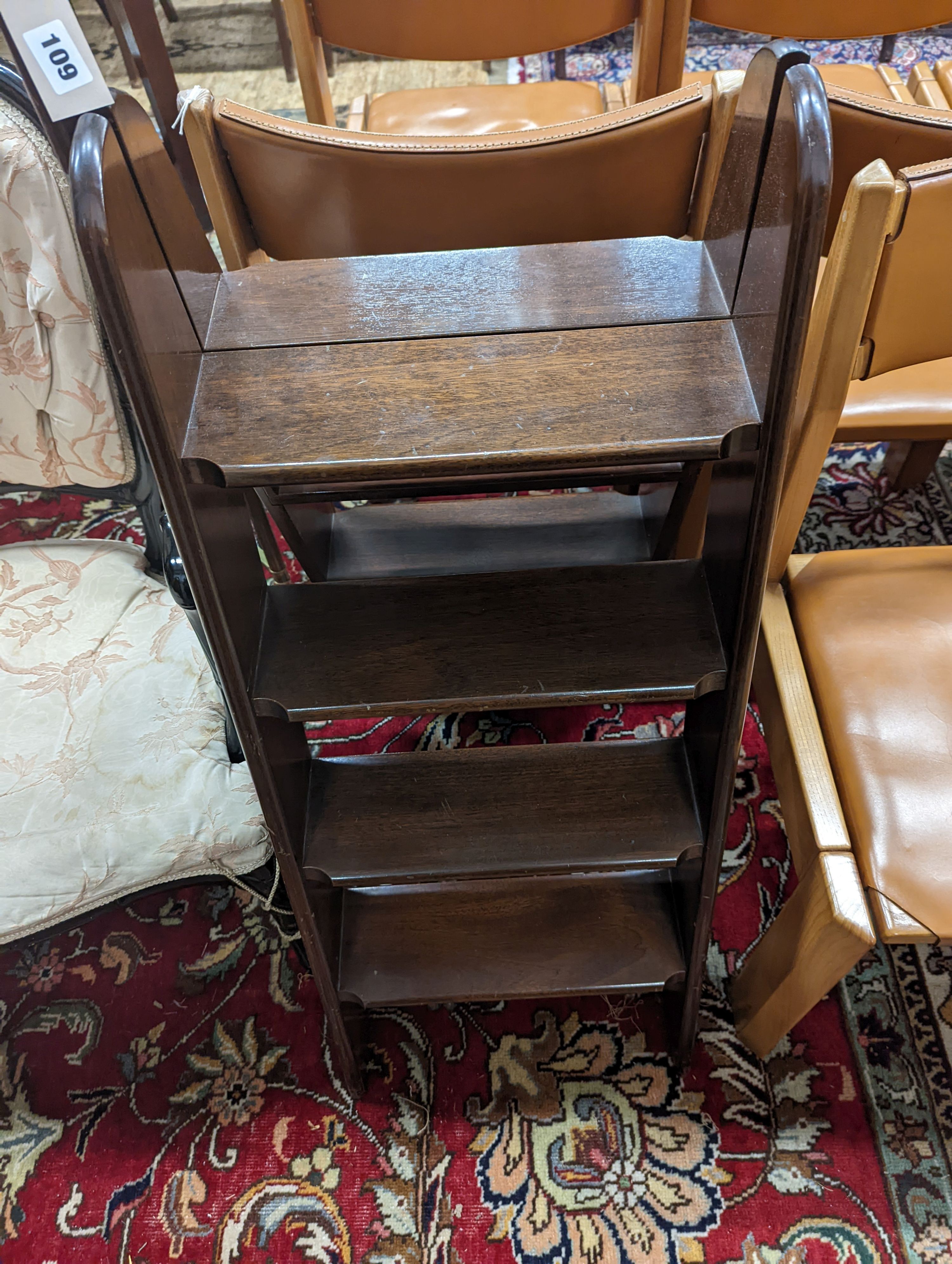 A pair of mahogany four tread folding library steps, width 44cm, 170cm